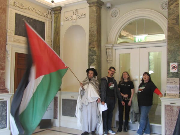 Arrests Made As Activists Chain Themselves To Department Of Justice For Gaza Visas